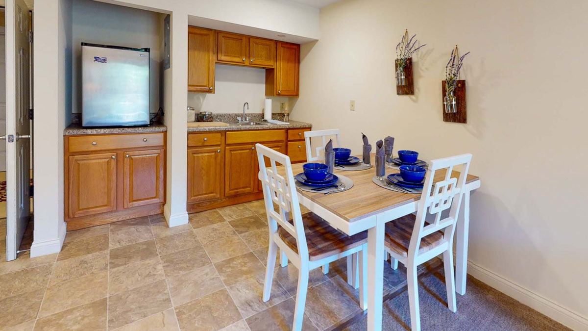 Kitchen and dining area in an Autumn Ridge model apartment